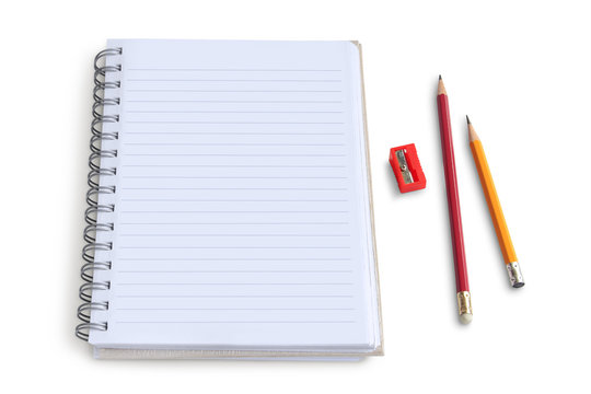Blank notepad with pencil and  sharpener on white background