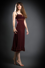 Obraz premium brunette in a red dress