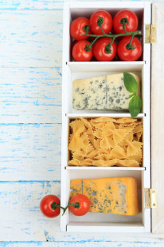 Italian products in wooden box on table close-up