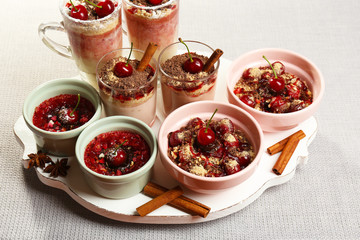 Tasty cherry dessert on table