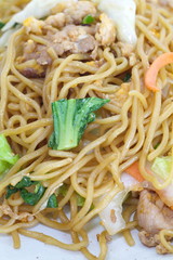 Chinese food stir - fried noodles with pork and vegetables