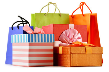 Gift boxes and colorful gift bags isolated on white