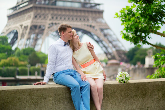 Just married couple hugging near the Eiffel tower