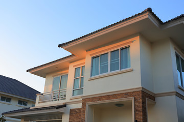 Big house modern style with sunshine and blue sky background