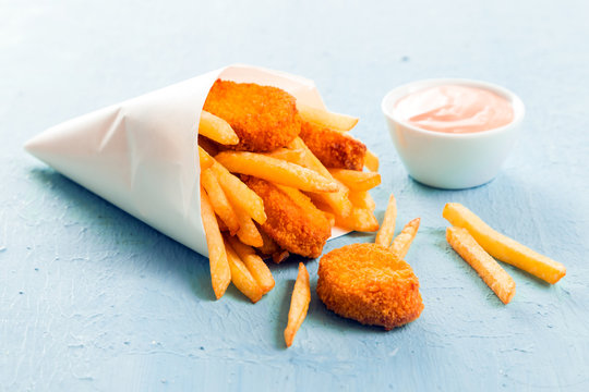 Golden fish nuggets with fried potato chips