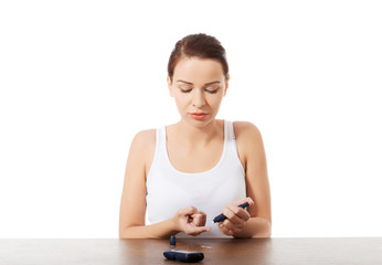 Woman taking sugar level test