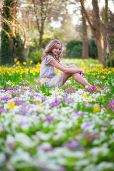 Beautiful young girl in forest on a spring day