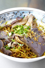 close up yellow noodle and duck steam in thailand