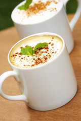 hot coffee in ceramic cup on wooden table