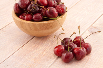 Fototapeta na wymiar Bowl with red ripe cherries