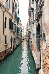 Obraz na płótnie Canvas Typical canal of Venice, Italy.