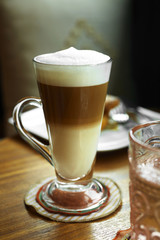 close up hot cappuccino in long glass