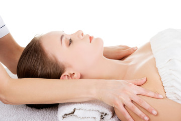 Fototapeta na wymiar Woman relaxing beeing massaged in spa saloon