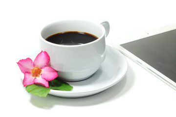 Coffee cup with flower isolated on white background.