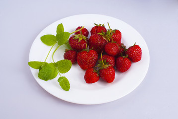 strawberry and mint on a plate