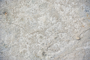 Gray cracked concrete texture background, close up