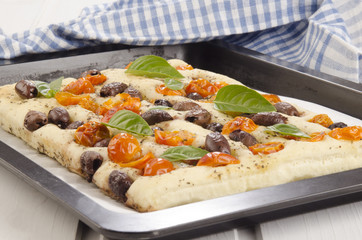 mediterranean flatbread with cherry tomatoes and olives