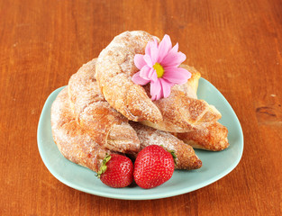 Fresh bagels with strawberry in the plate