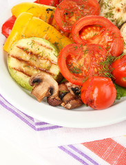 Delicious grilled vegetables on plate on table close-up