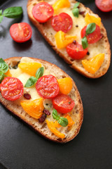 Tasty bruschetta with tomatoes in pan, close up