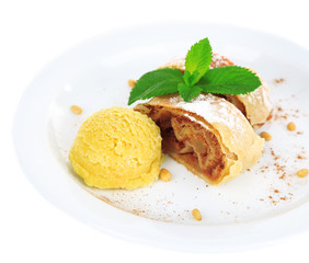 Tasty homemade strudel with mint leaves and ice-cream