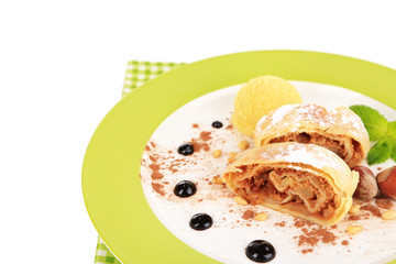 Tasty homemade apple strudel mint leaves and ice-cream