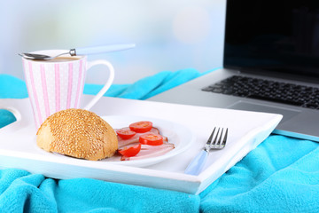 Composition with laptop and tasty breakfast
