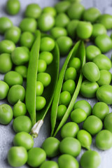 Fresh green peas on wooden background