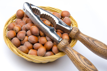 Hazelnuts in a basket with a nutcracker