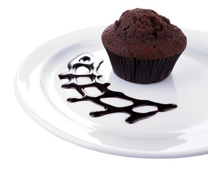 Chocolate muffin on plate isolated on white