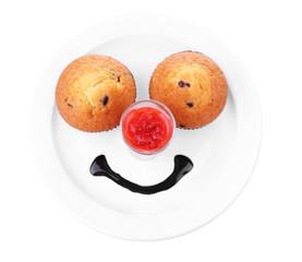 Two tasty muffins on plate isolated on white