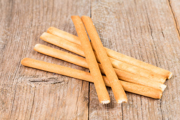 bread sticks grissini on wooden background