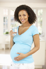 Pregnant woman drinking water