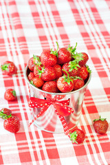 Heap of fresh ripe red strawberry in decorative aluminium bucket