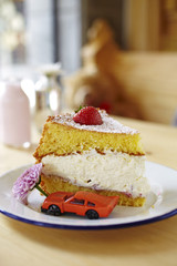 close up strawberry cream cake in coffee shop