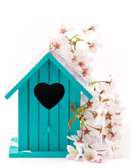 Naklejka na ściany i meble Little Birdhouse in Spring with blossom flower