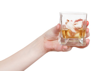 hand holds glass with whiskey isolated