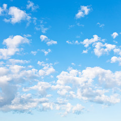 Obraz na płótnie Canvas many little fluffy clouds in blue sky