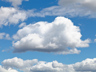 Naklejka na ściany i meble fluffy cloud in blue afternoon sky