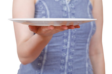Fototapeta na wymiar woman holds empty white plate on hand