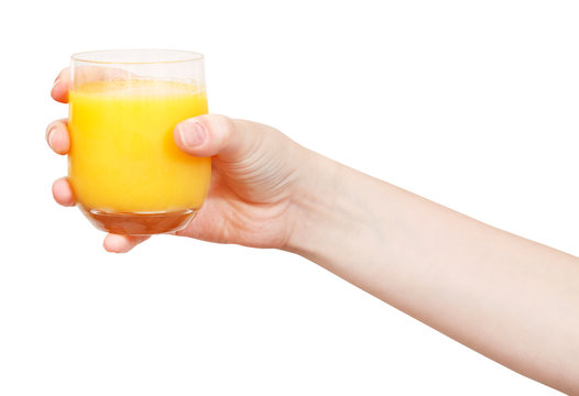 Hand Holds Glass With Fresh Orange Juice