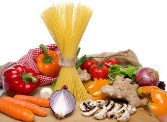 Composition of uncooked spaghetti and different types of vegetab