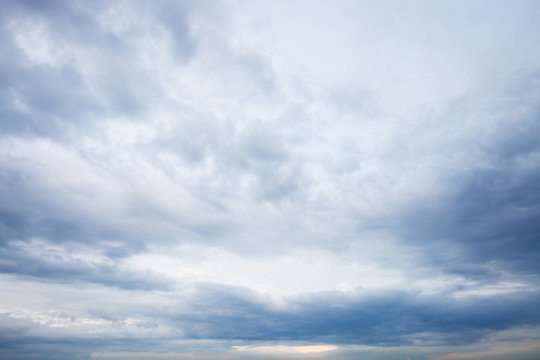 Fototapeta grey blue clouds in evening sky