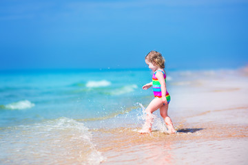 Little girl running on a beach