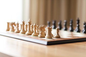 Chess pieces set on a chessboard