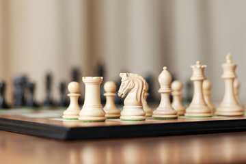 Chess pieces set on a chessboard