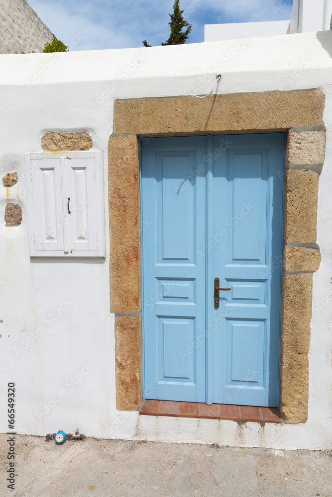 Wall mural Traditional door house at Patmos island in Greece