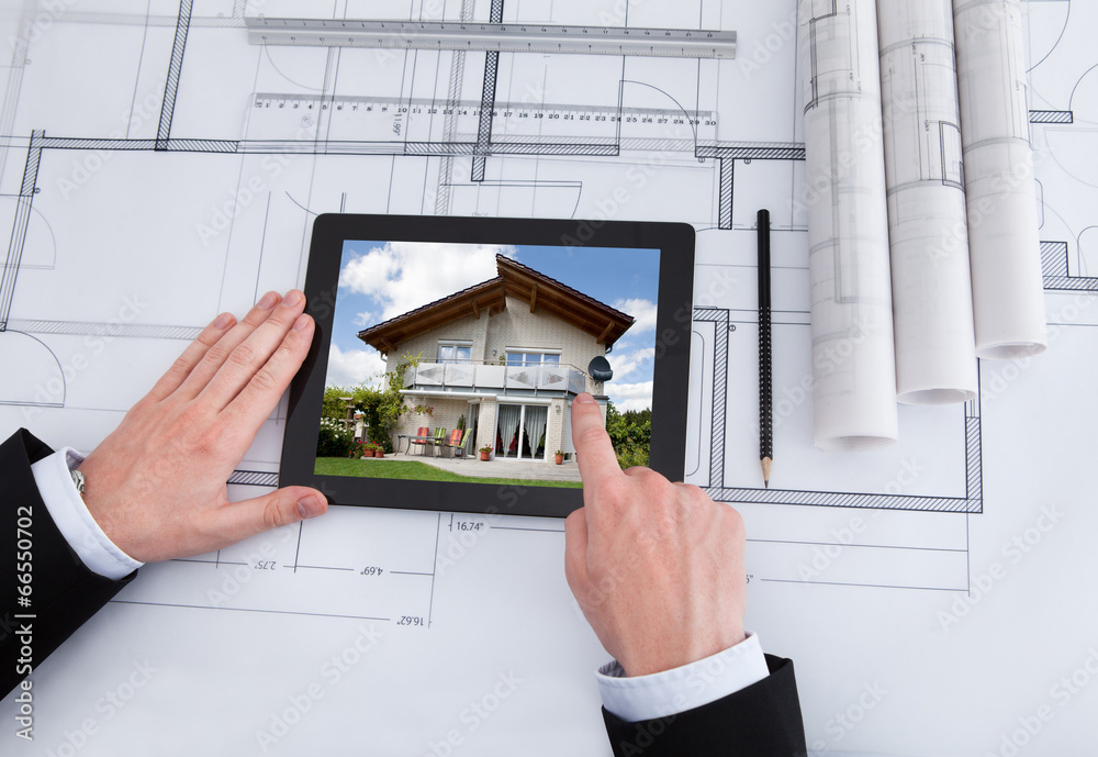 Poster Architect Using Digital Tablet On Blueprint In Office