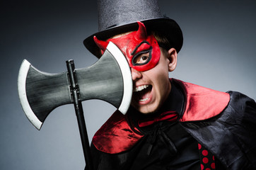 Funny devil against dark background
