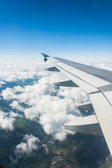 Fototapeta na wymiar Airplane wing out of window